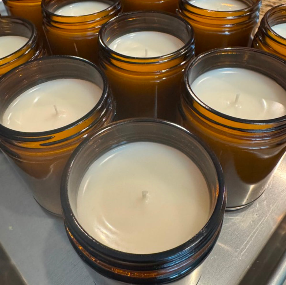 Freshly poured candles cooling on a tray