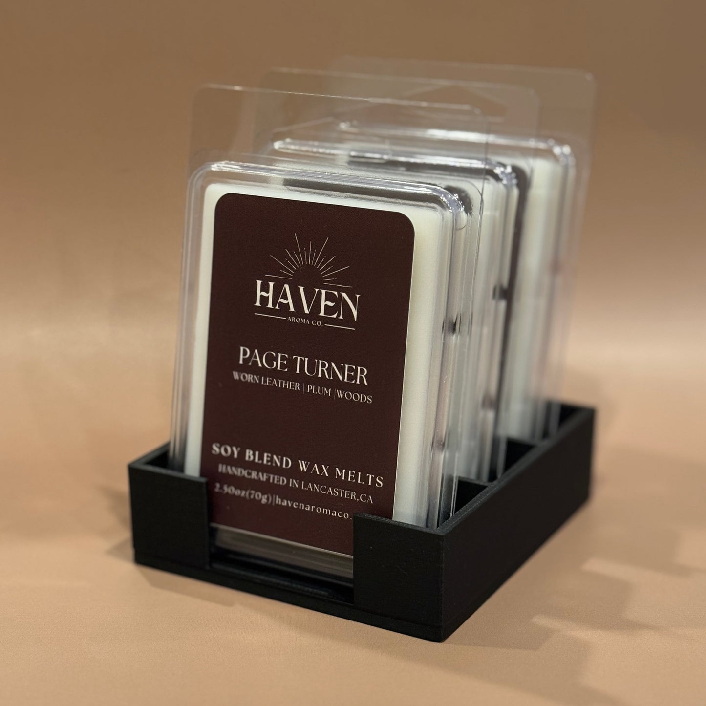 Packaged Haven Page Turner soy blend wax melts on a beige background