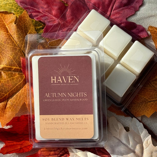 Package of Haven brand Autumn Nights wax melts displayed with fall leaves in the background.