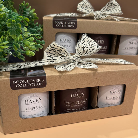 Picture of Unplug, Page Turner and Homebody candles packaged in kraft box wrapped with a box