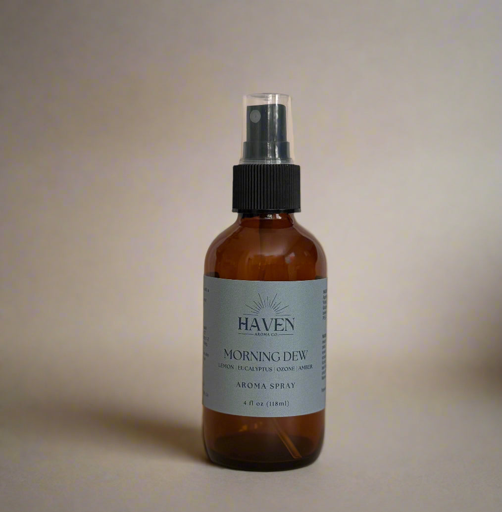 Brown spray bottle with a label on a beige surface